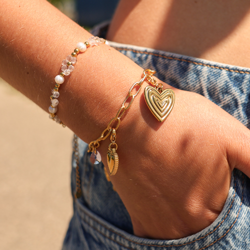 Cr&eacute;ez des colliers et des bracelets enjou&eacute;s avec des breloques en forme de coeur en acier inoxydable